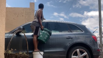 Water spill and a bucket mishap during a car wash turn vlog into comedy gold