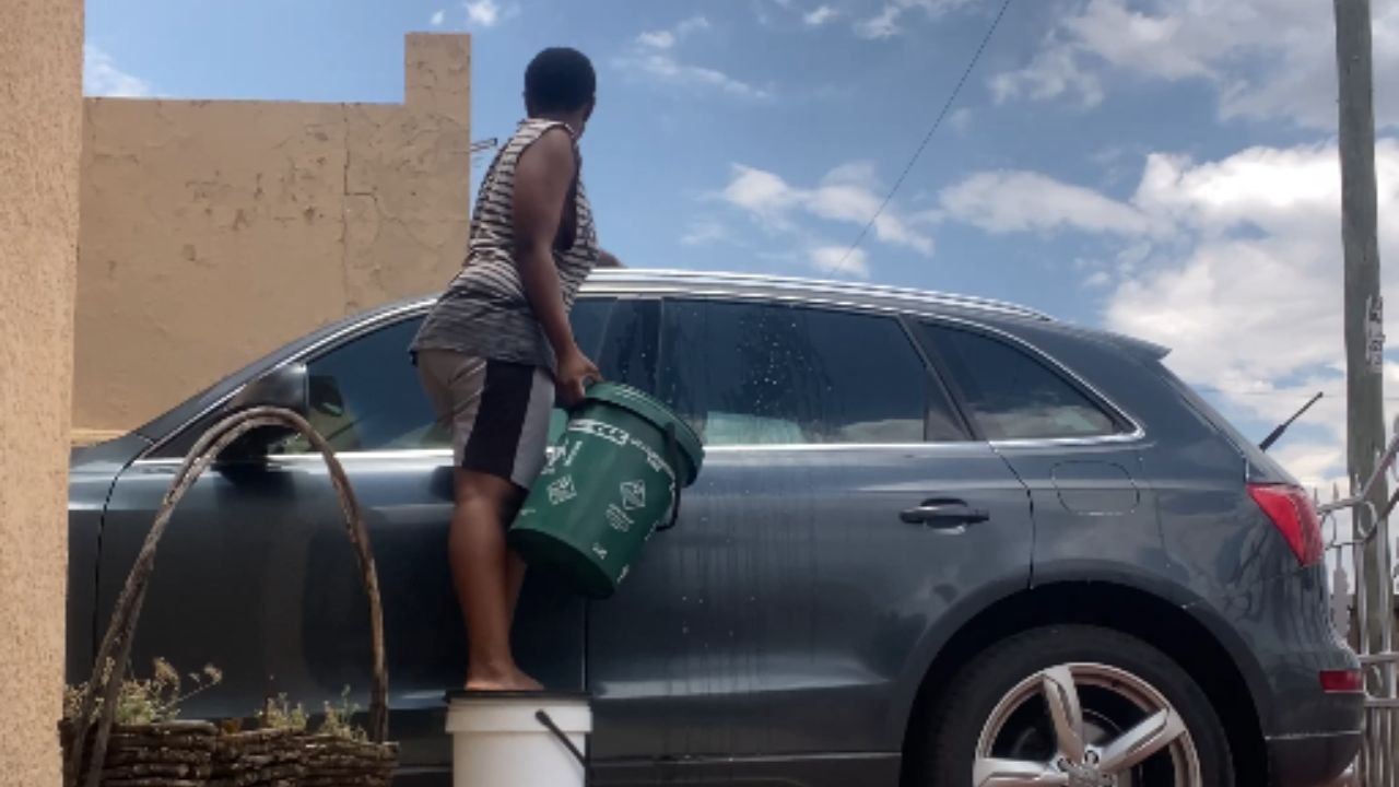 Water spill and a bucket mishap during a car wash turn vlog into comedy gold