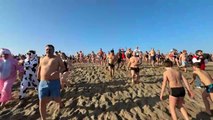 Hundreds of people take a New Year's dip in southern France