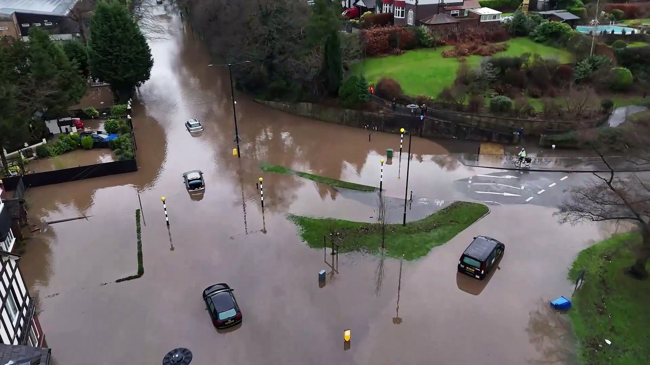 Roads flooded and cars submerged as heavy rain hits the UK