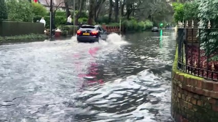 Cars abandoned after overnight rain floods roads in Manchester