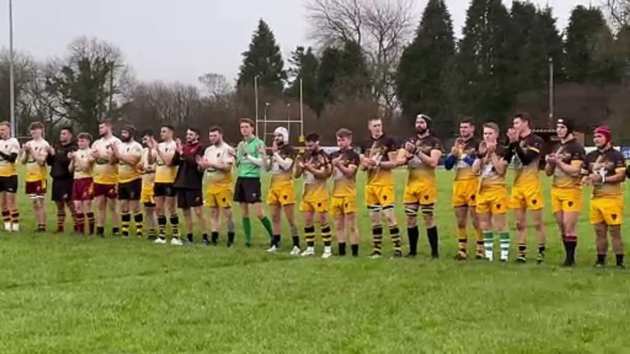Minute's applause during the North Tawton RFC memorial game (Alan Quick, Crediton Courier)