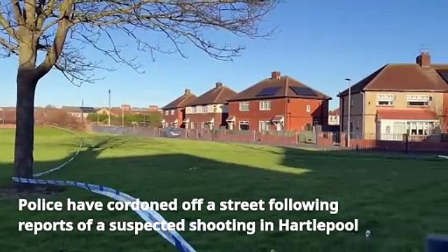 Police cordon off road following suspected shooting