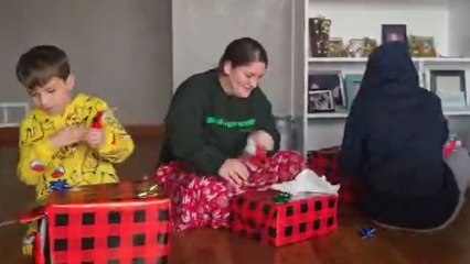 Little boy shouts 'Oh my God' as he opens his Christmas present
