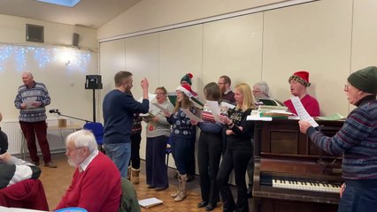 Volunteer choir singing Deck the Halls at Rotary Club of Crediton Boniface’s New Year Afternoon Tea Party for senior citizens (Will Goddard, Crediton Courier)