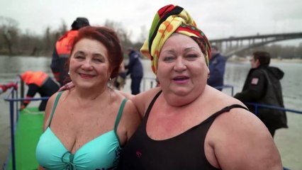 Ukrainians celebrate Epiphany with a plunge in the Dnipro river