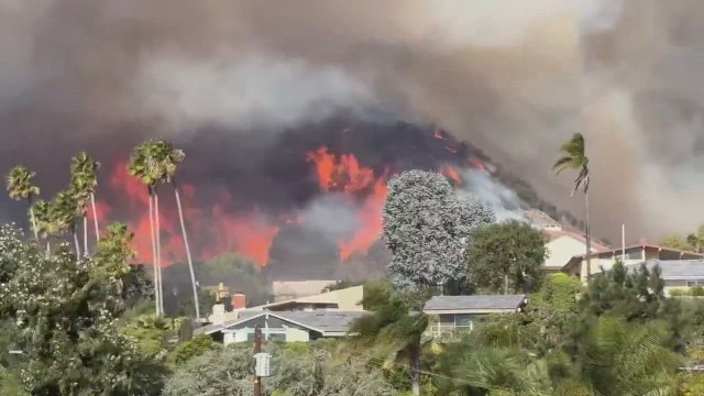 Wildfires erupt in Los Angeles as powerful windstorm hits Southern California