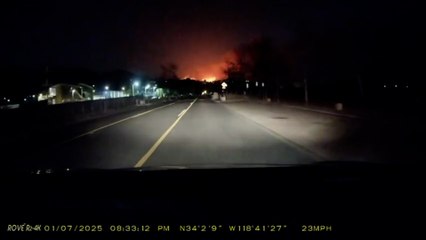Dashcam footage shows Pacific Palisades wildfire burning at night
