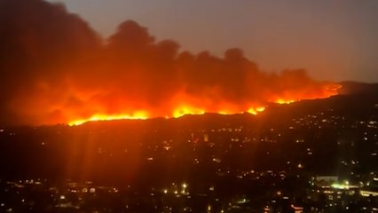Video shows huge wildfire burning through Los Angeles suburb