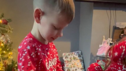 Heartwarming reaction of young boy unwrapping a new Xbox on Christmas morning