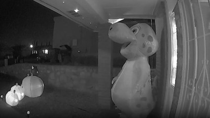 Girl dresses as friendly ghost and hands out candy by the fistful