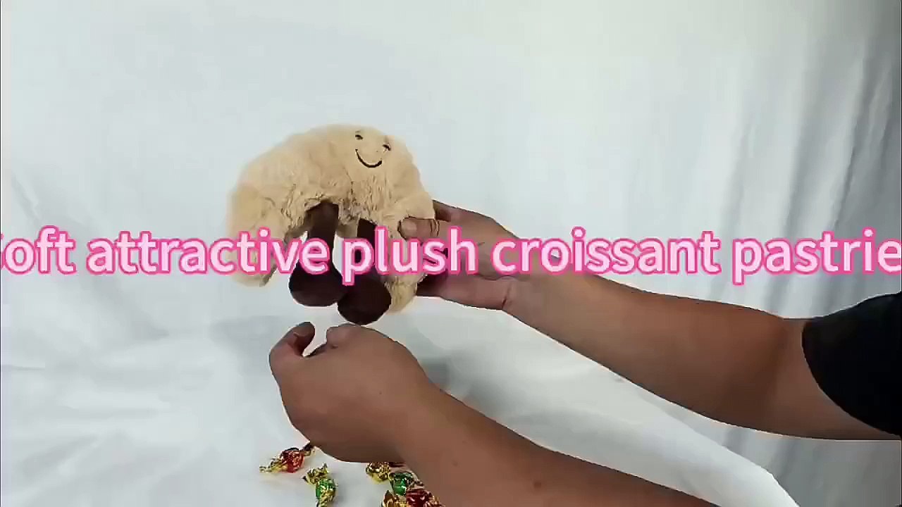 Soft charming plush cartoon croissant bread pillow stuffed croissant candy bag toy.