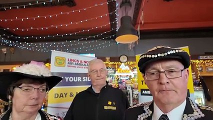 Pearly King and Queen of Skegness present cheque to Air Ambulance