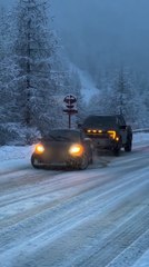 Sports Car Zigzags While Towing SUV on Ice