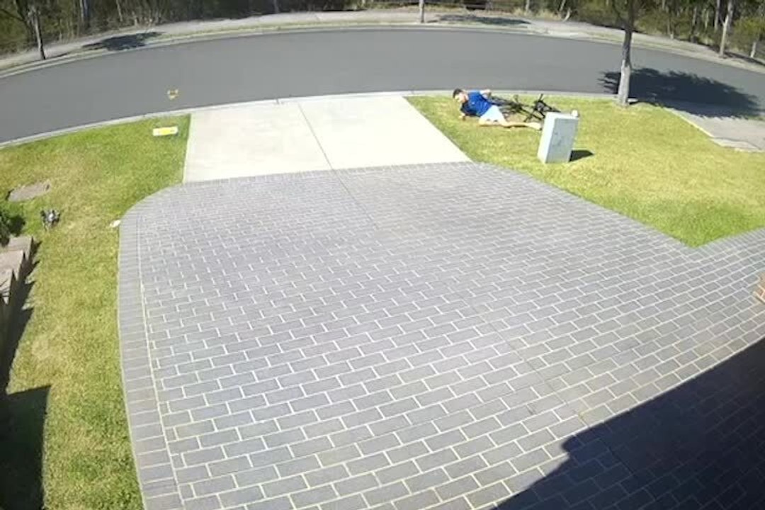 Boy Falls Face-First After Braking Too Hard on Bike