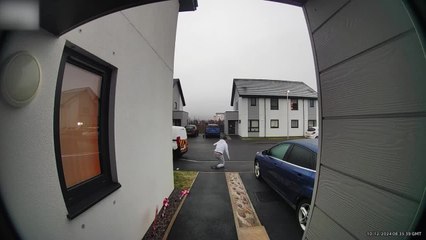 Security Camera Captures Man Slipping And Falling As He Exits His House