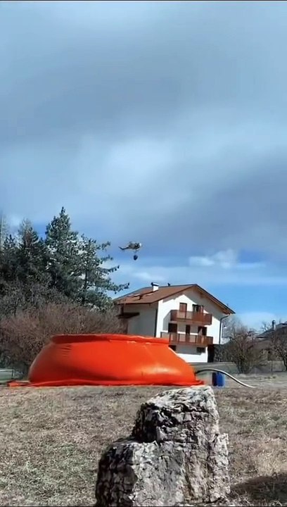 "Battling the Blaze: Aerial Water Drops in Action"