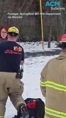 Heroic moment woman and her dogs are rescued from frozen pond