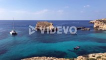 luxury yacht moored in comino island Mediterranean Sea during sunny day of summer