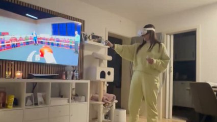 Woman's enthusiastic VR boxing match interrupted by a funny fail