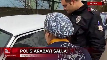 Araçta uyuyan genci uyandırmak için polis dakikalarca uğraştı
