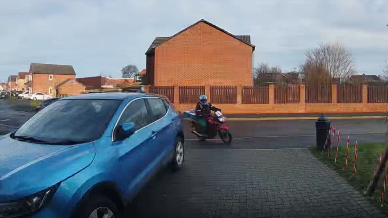 Bike rider forgets to lift leg over food warmer and takes a tumble