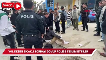 Yol kesen bıçaklı zorbayı dövüp polise teslim ettiler