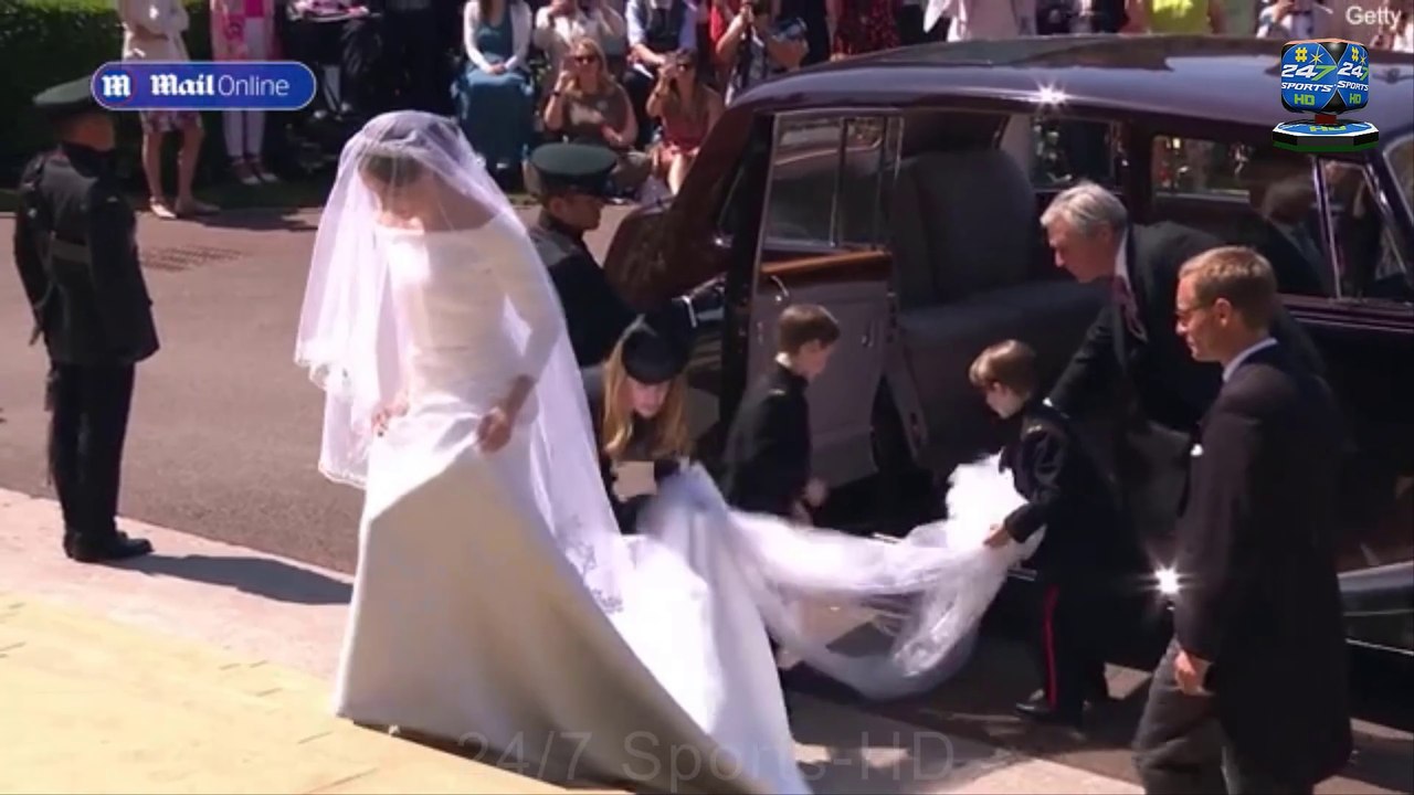 REVEALED: The reason why Meghan Markle was left to struggle with her wedding veil by the escorting officer