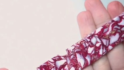 Artist designs red and gold jewelry pieces to reflect timeless style