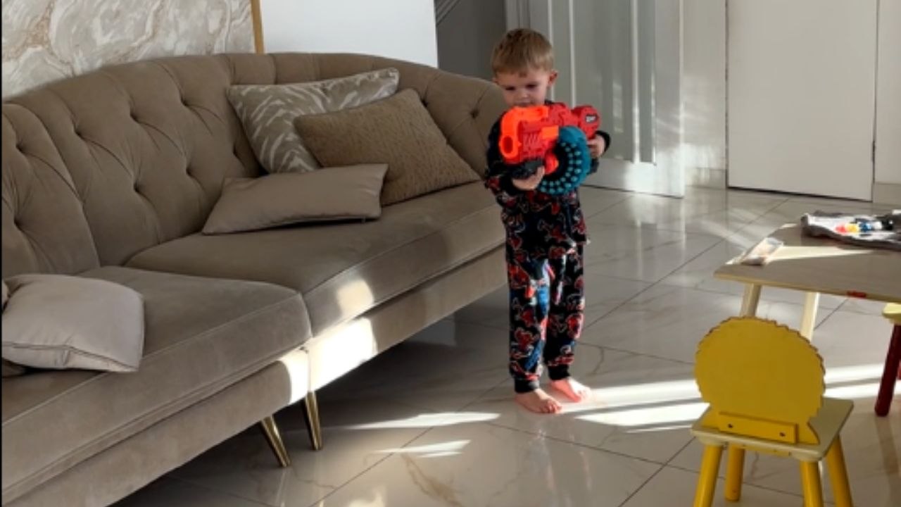 Hilarious moment as boy's Nerf blaster shot accidentally lands on mom's head