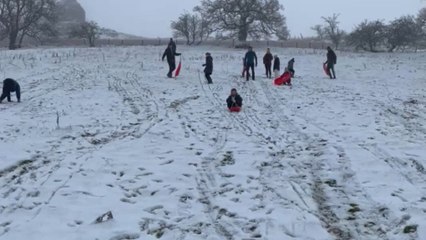 Winter fun turns comedic as Mum’s sledding ride ends on a laughable note