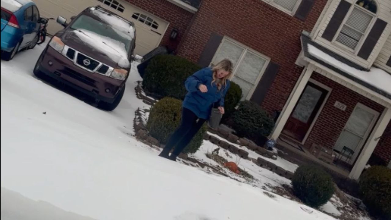 Woman captures coworker's comedic botch moment while picking her up on an extremely chilly morning