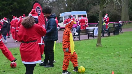 Santas fill West Park for the Beacon Santa run.