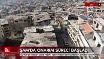 Suriye'de bombalanan binalar onarılıyor