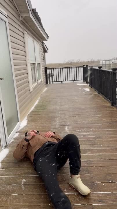 Man Falls on Back While Sliding on Ice