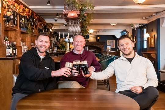 Former England international Danny Care kicks a rugby ball into space