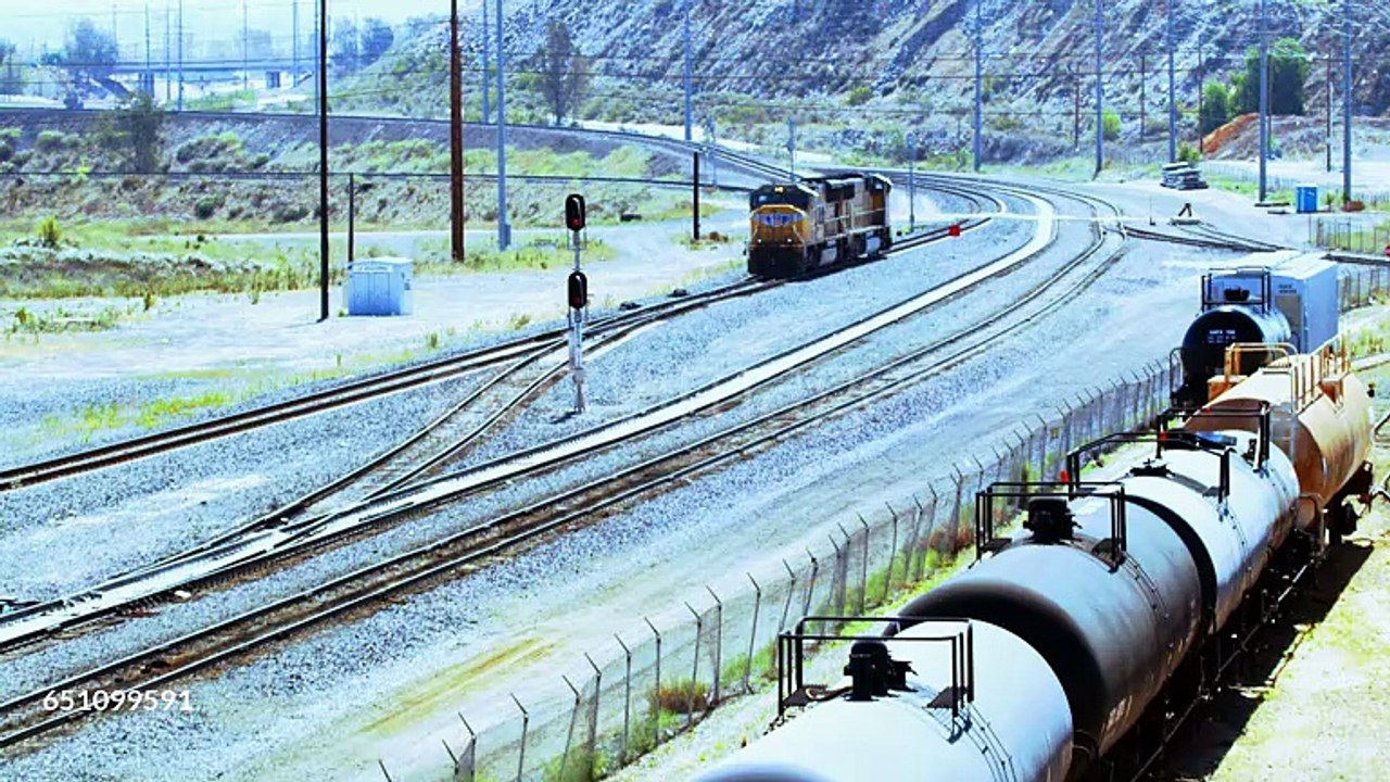 Four linked Union Pacific train engines roll into a rail yard in Colton, California. - HD stock videogettyimages-651099591-640_adpp