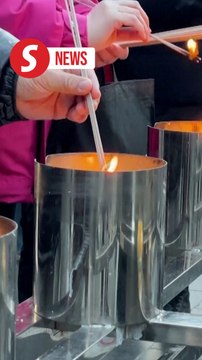 Beijing residents usher in the Year of the Snake with prayers at Lama Temple