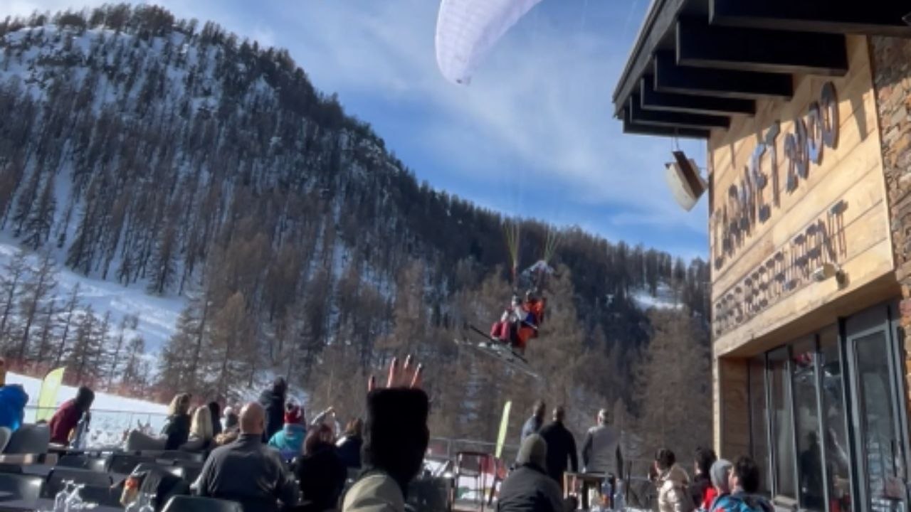 Hilarious paragliding fail: Paraglider lands right on unsuspecting people