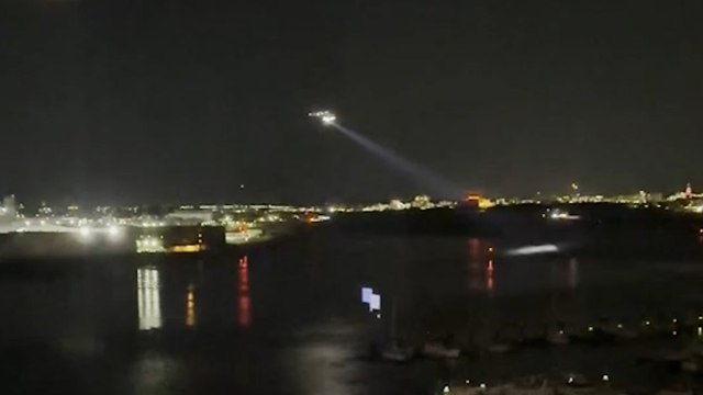 Emergency crews search Potomac river after plane collides with military helicopter