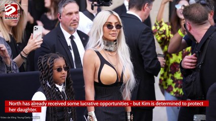Kim Kardashian is determined to "protect" her children from the pressures of fame