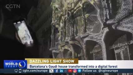 Gaudi house lit up by digital art show