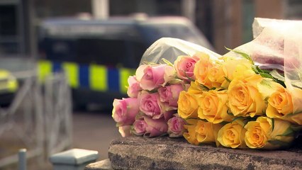 People lay flowers outside of Sheffield school