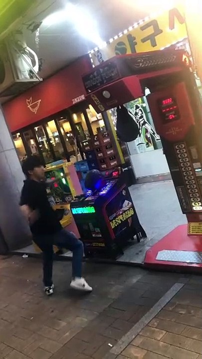 Boy Tries to Kick Punching Machine But Misses
