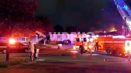 Fireman put out the fire of the house in Mississauga, Ontario, Canada