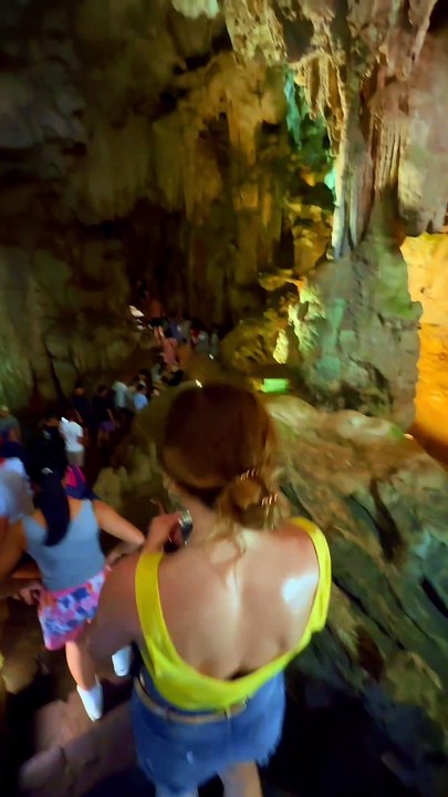 "🚶‍♂️✨ Stepping into the awe-inspiring Sung Sot Cave – Halong Bay's hidden wonder! Marveling at ancient limestone formations and nature's artistry. 🌄🕳️