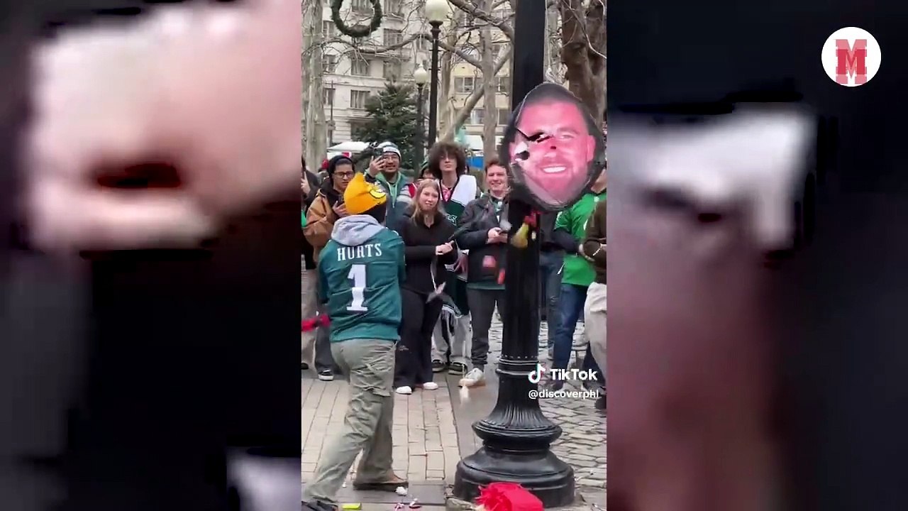 Eagles fans made a piñata with Travis Kelce's face on it and people hit it with a bat