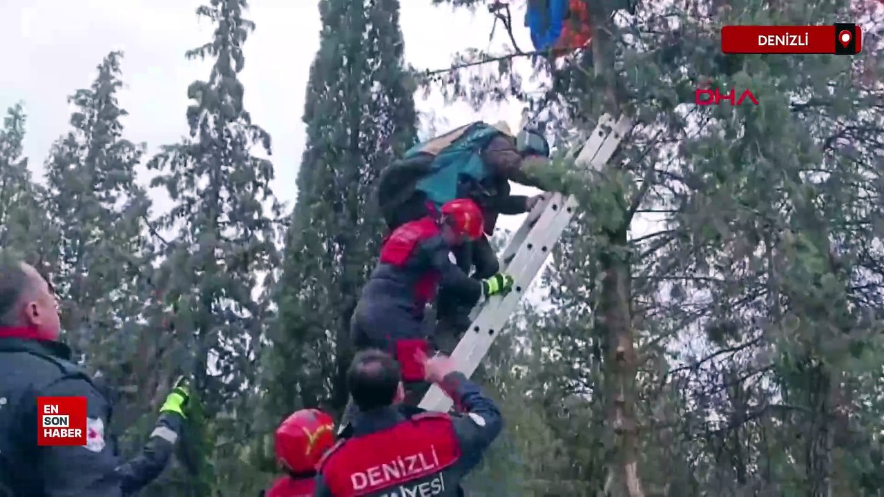 Denizli'de paraşütü ağaca takılan pilotu itfaiye kurtardı