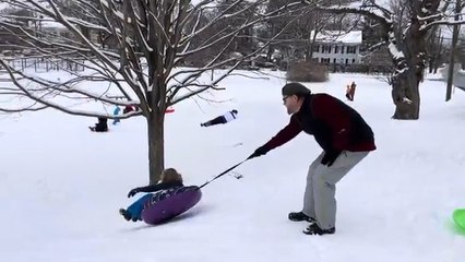 Boy Tumbles Down Snowy Hill After Dad Holds Back Sled Tether