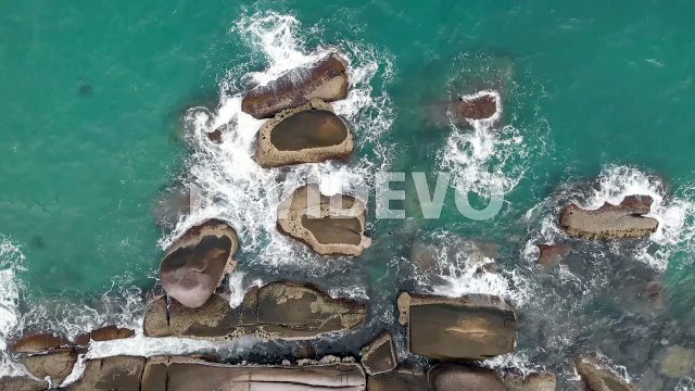 Aerial view of ocean waves crashing on the rocks, Bird eye view of sea waves